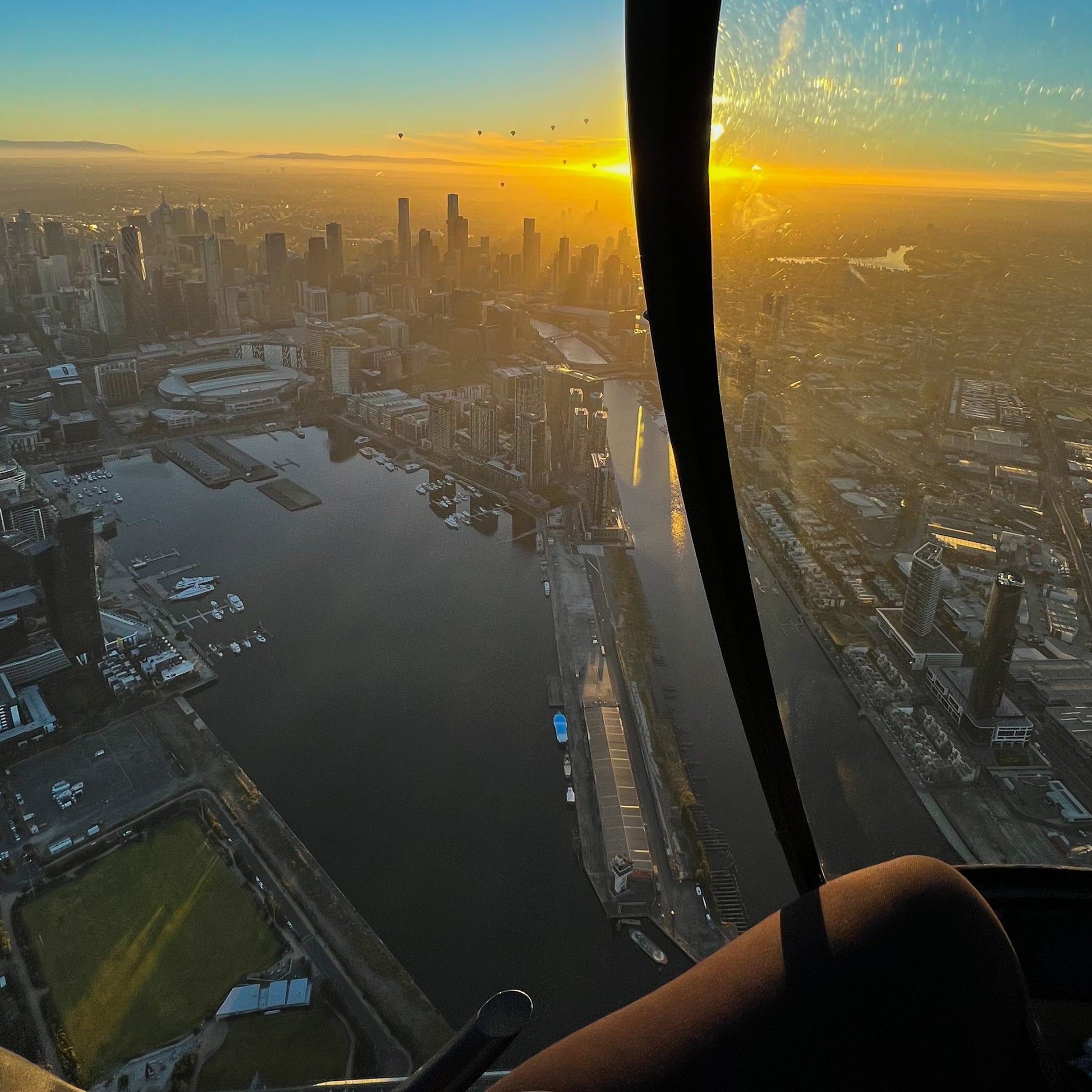 Sunrise views of Melbourne CBD during a helicopter ride by Rotor One