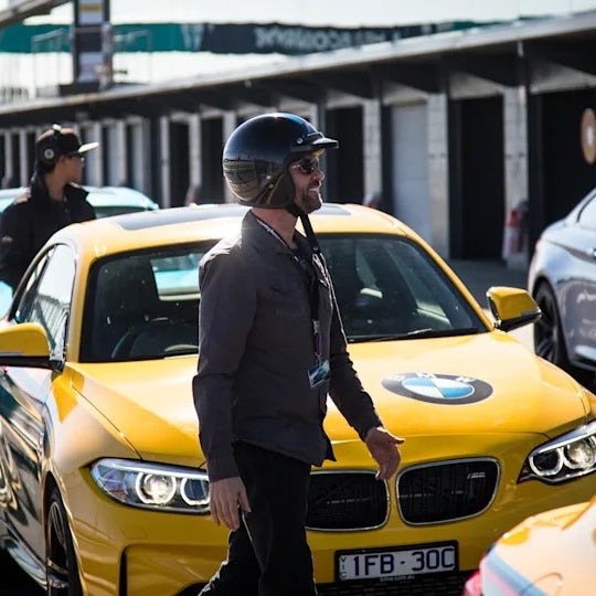 Race cars and driver ready for BMW driving experience in Philip Island